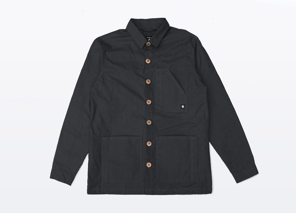 Black Unisex Overshirt handmade in Britain from weatherproof waxed organic cotton and sustainably sourced natural corozo nut buttons.