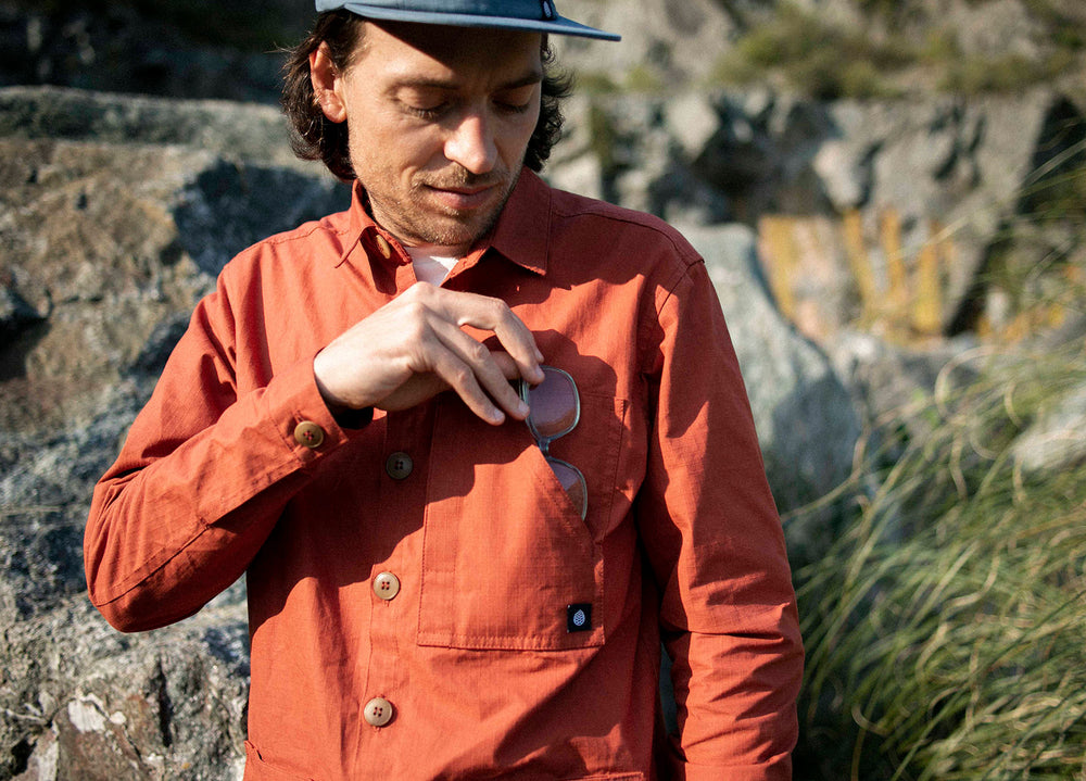 Rust coloured Unisex Overshirt handmade in Britain from weatherproof waxed organic cotton and sustainably sourced natural corozo nut buttons.