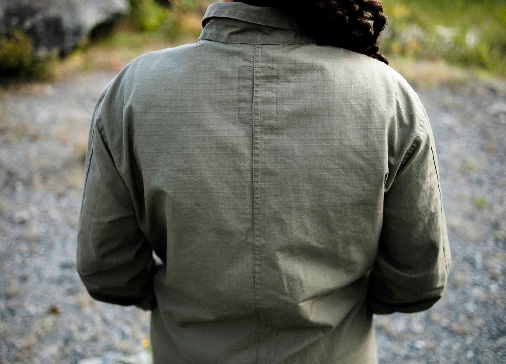 Olive coloured Unisex Overshirt handmade in Britain from weatherproof waxed organic cotton and sustainably sourced natural corozo nut buttons.