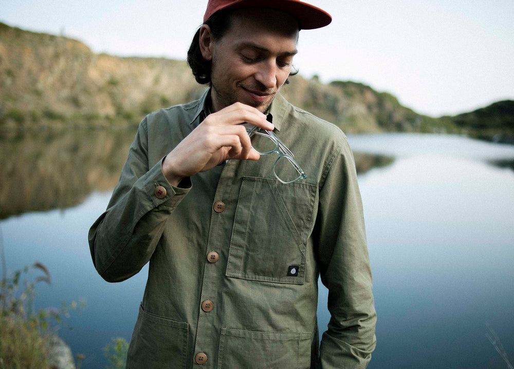 Olive coloured Unisex Overshirt handmade in Britain from weatherproof waxed organic cotton and sustainably sourced natural corozo nut buttons.