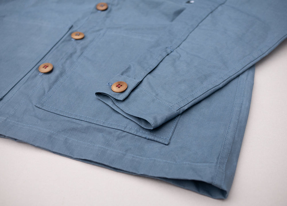 Sky Blue Unisex Overshirt handmade in Britain from weatherproof waxed organic cotton and sustainably sourced natural corozo nut buttons.