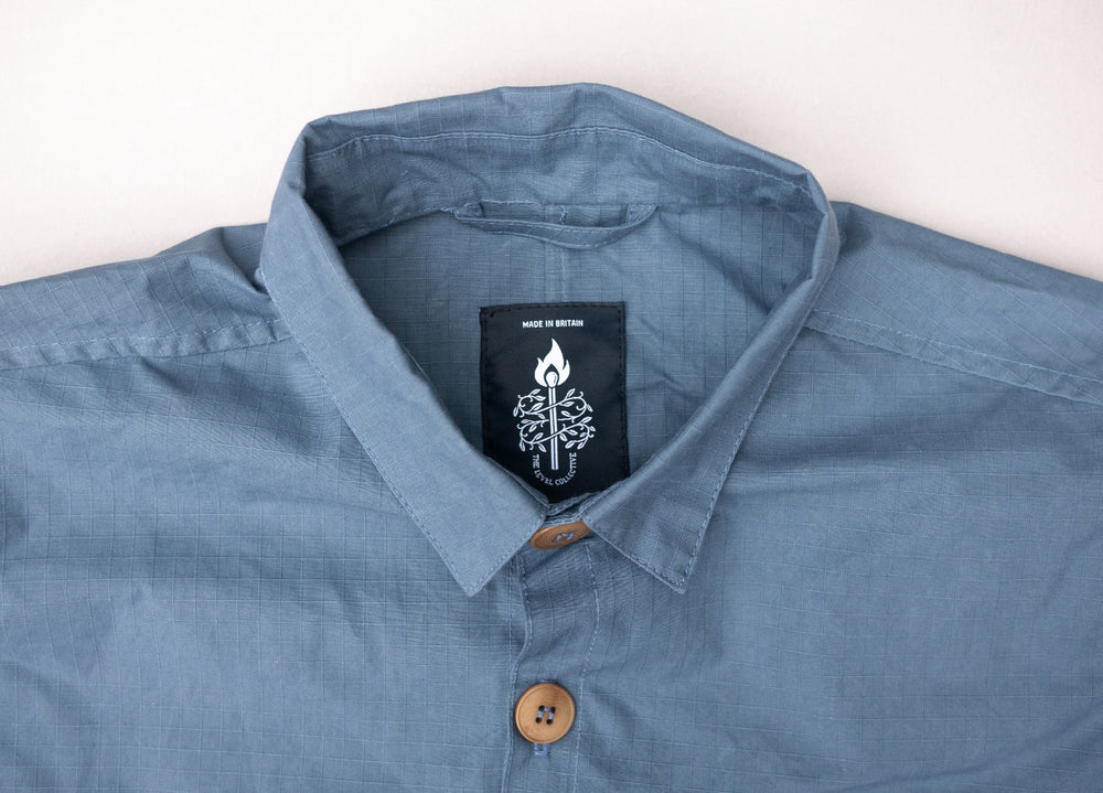 Sky Blue Unisex Overshirt handmade in Britain from weatherproof waxed organic cotton and sustainably sourced natural corozo nut buttons.