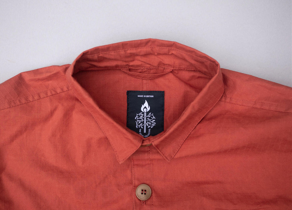 Rust coloured Unisex Overshirt handmade in Britain from weatherproof waxed organic cotton and sustainably sourced natural corozo nut buttons.