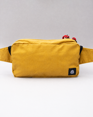 The Scout cross body bag in Mustard waxed organic cotton, front view