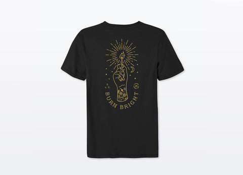 Black Unisex T-shirt made with sustainable organic cotton. Large Design on Back reading Burn Bright under drawn hand holding a lit match printed in gold.
