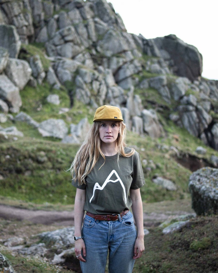 Walker in a Simple Mountain organic cotton t-shirt among granite rocks
