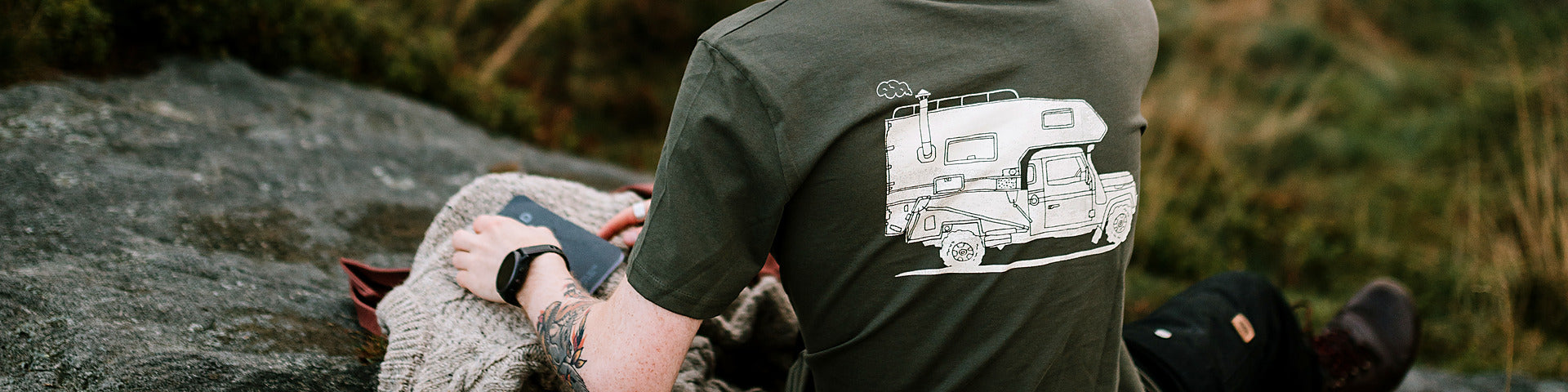 Live Simply organic cotton t-shirt with hand-drawn campervan print, worn on the moors