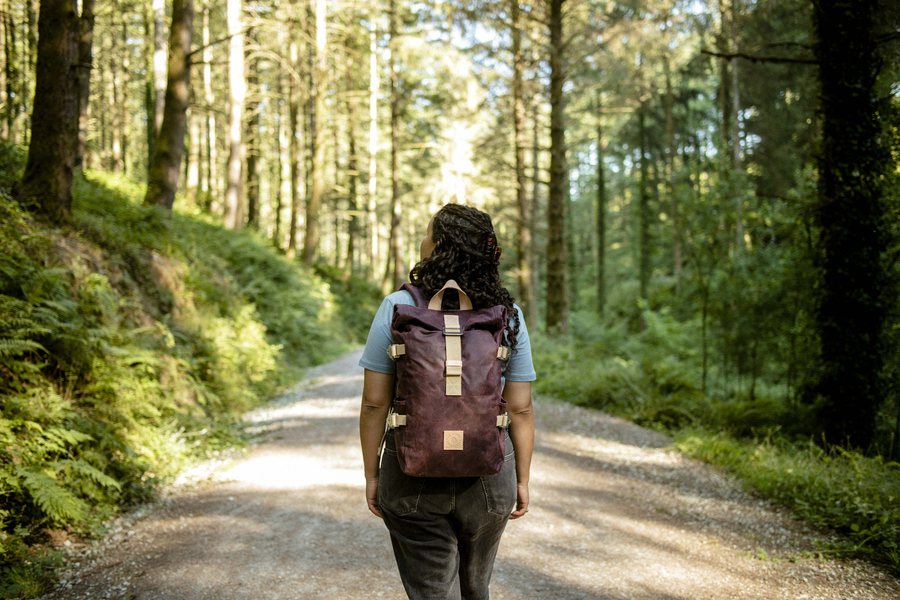 Winnats Roll Top in Cherry on a forest trail